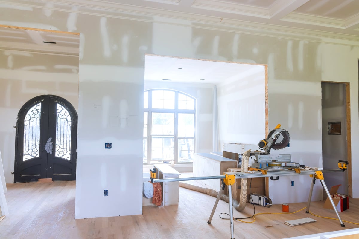A Geelong living space mid renovation with tools and unfinished walls