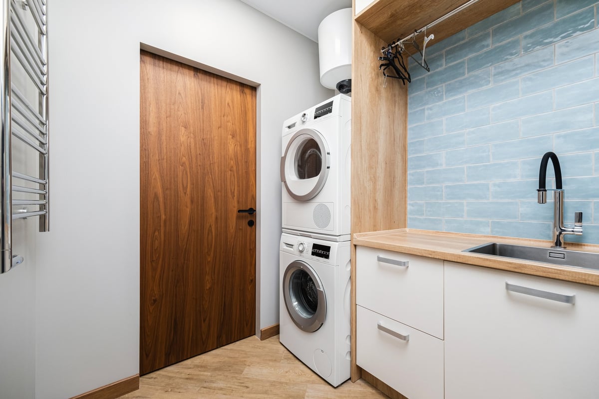 A finished laundry renovation in Geelong with built in storage by Morrissey Built