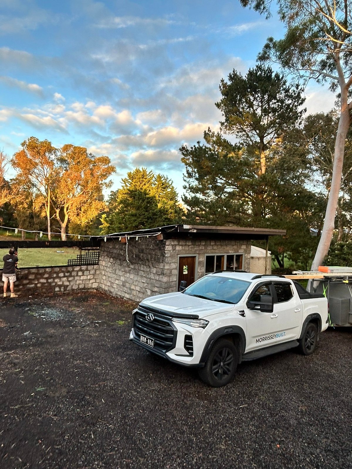 A Morrissey Built work ute outside a finished Geelong renovation at sunset
