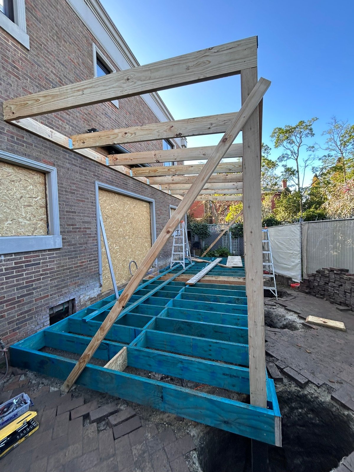 Timber pergola frame under construction on the Highton extension, with deck joists going down