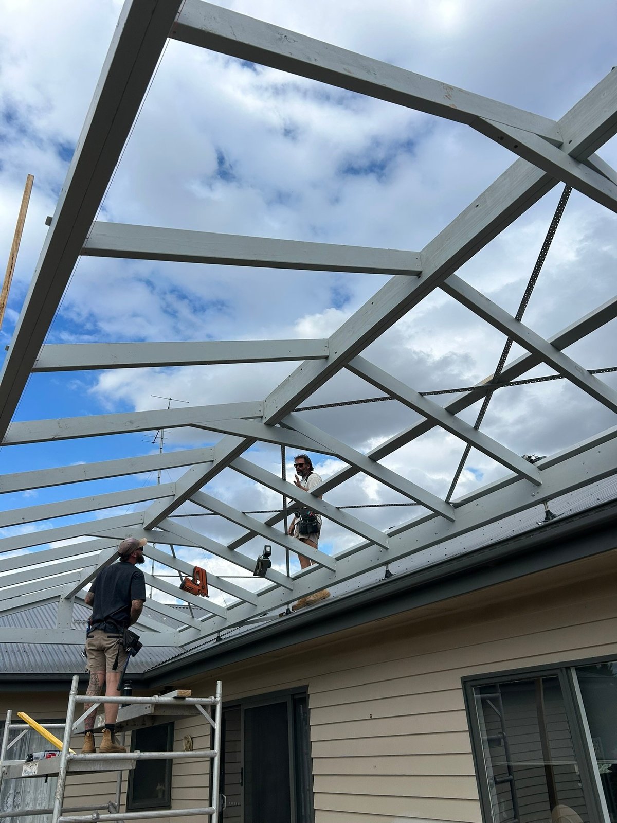 A glass roof structure being installed on a Geelong home by Morrissey Built
